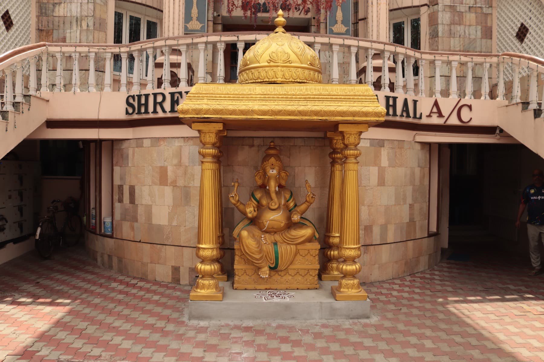 Golden Ganesha shrine at the mahal entrance