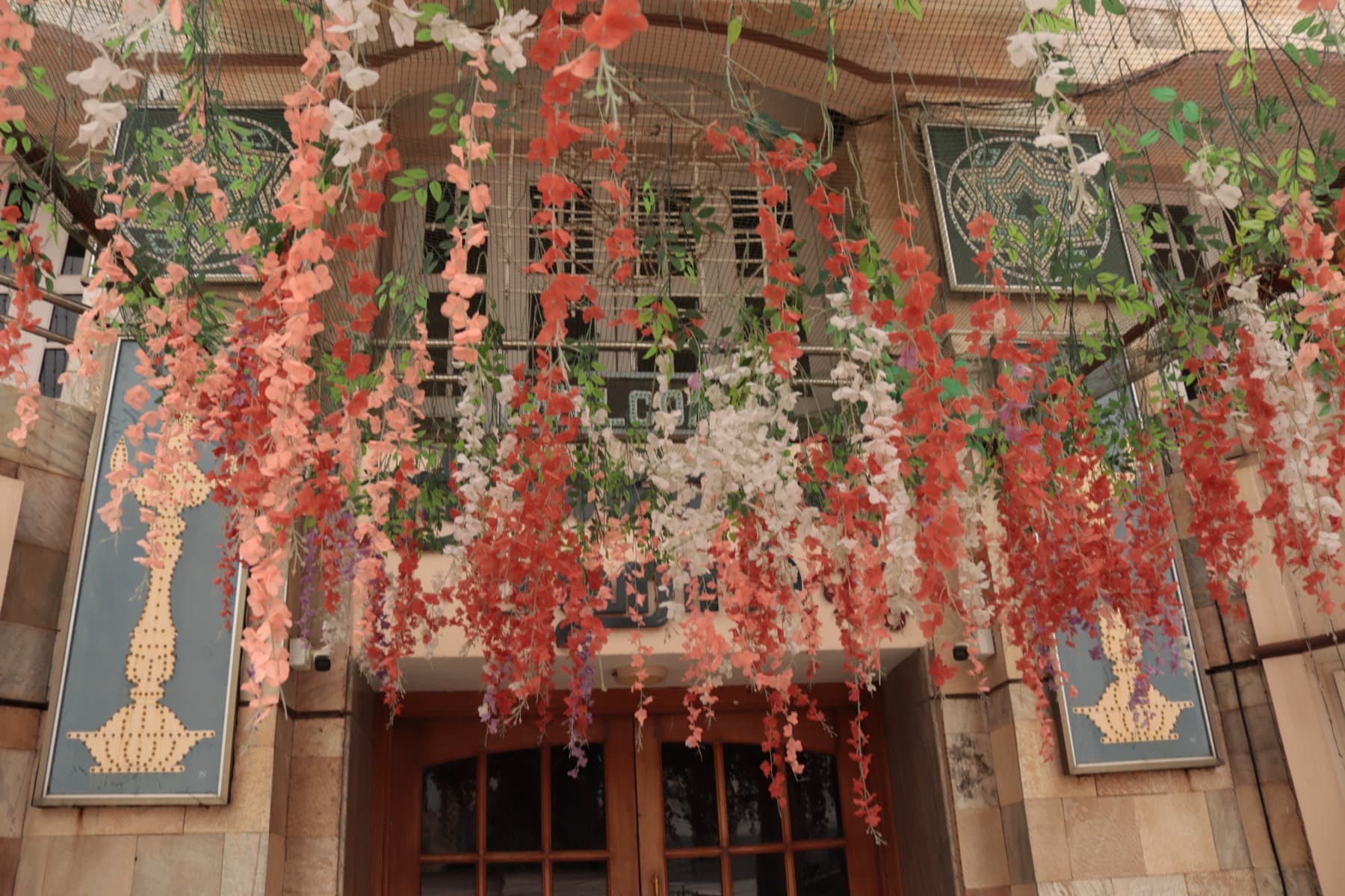 Hanging floral decoration above the mahal entrance