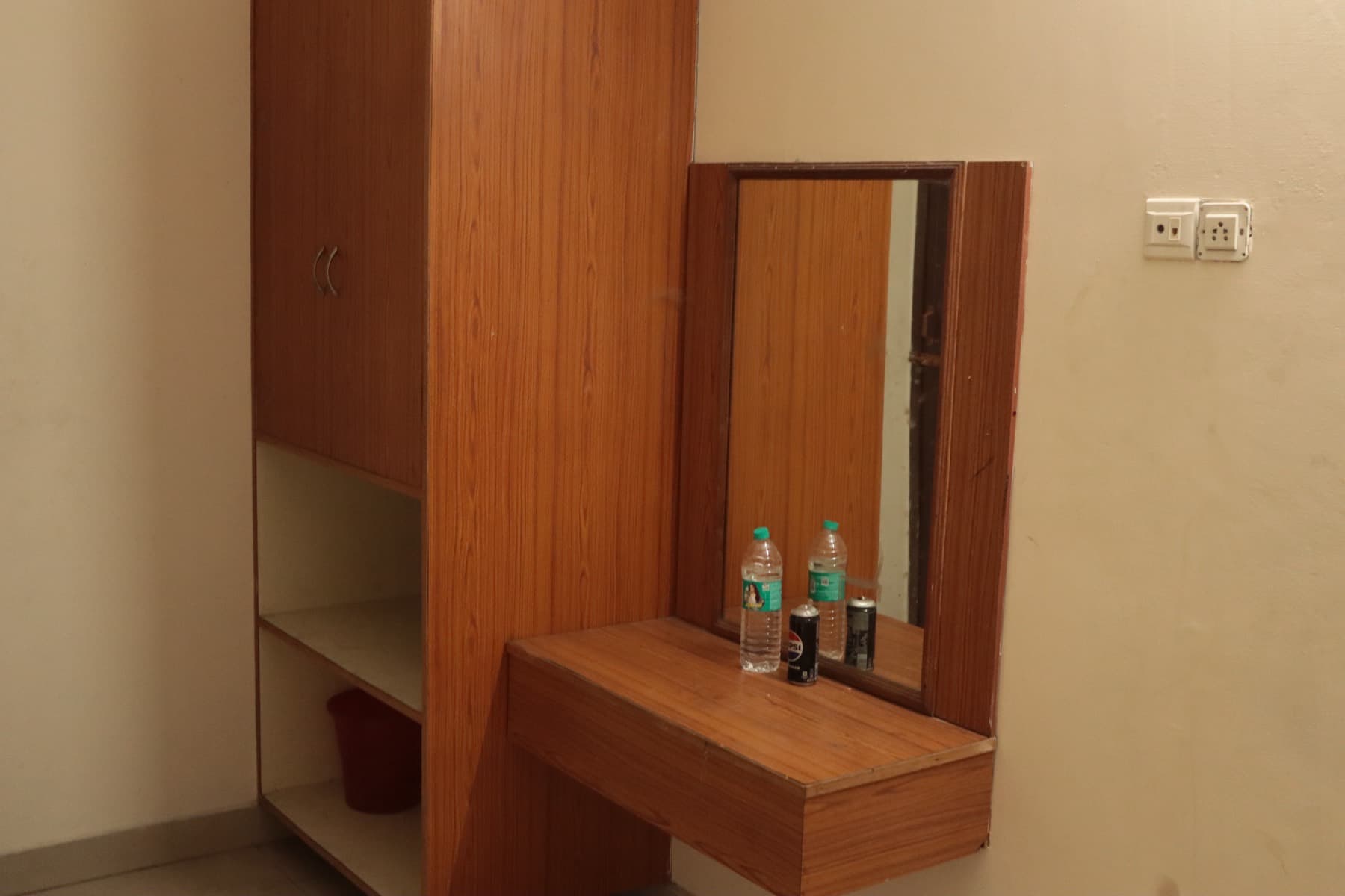 Wardrobe, work desk and mirror in the Deluxe AC Double Room