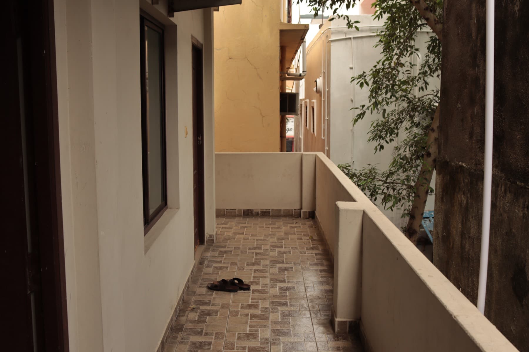 Open corridor leading to the rooms