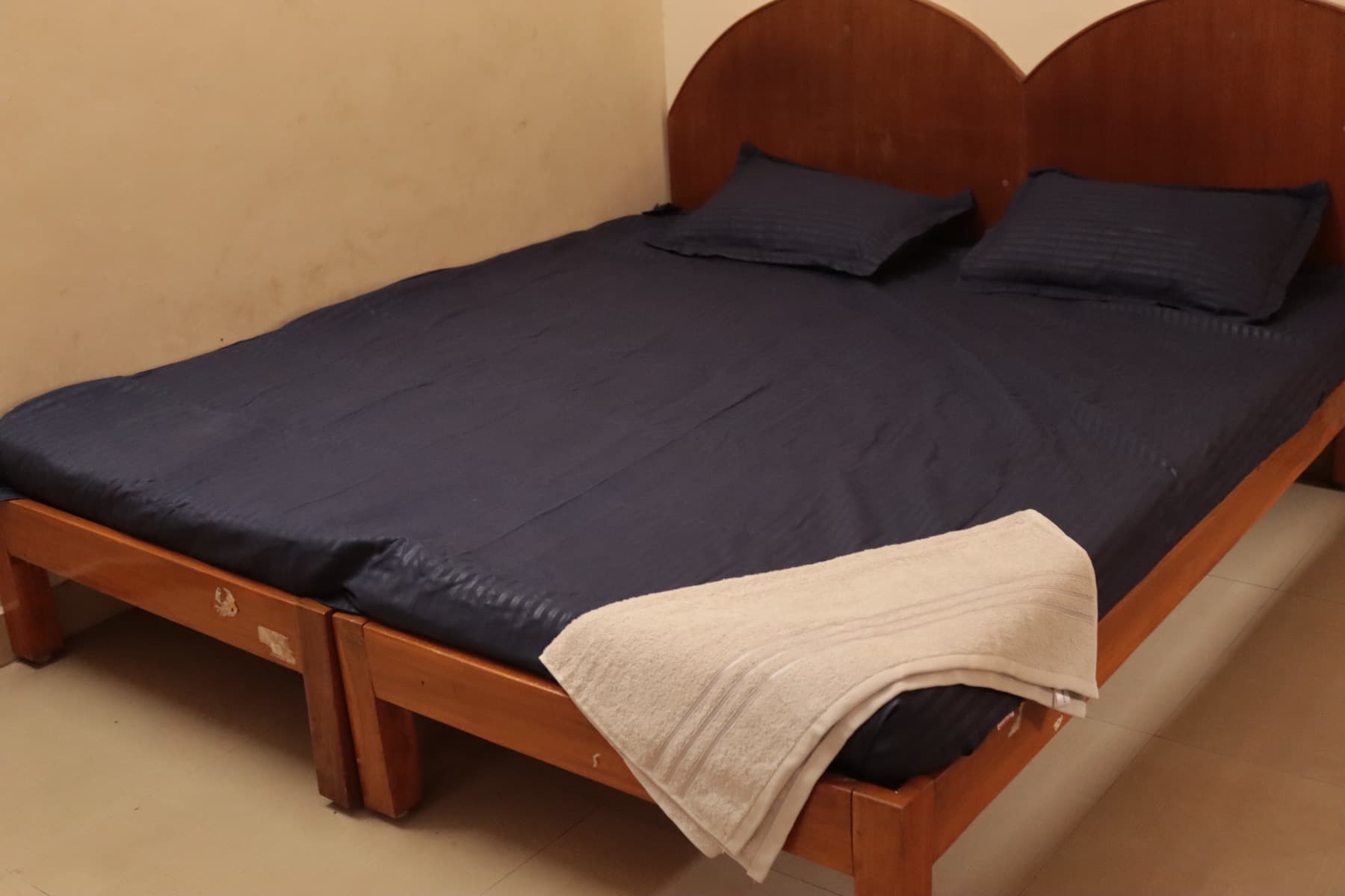 Deluxe AC Double Room bed with fresh towel