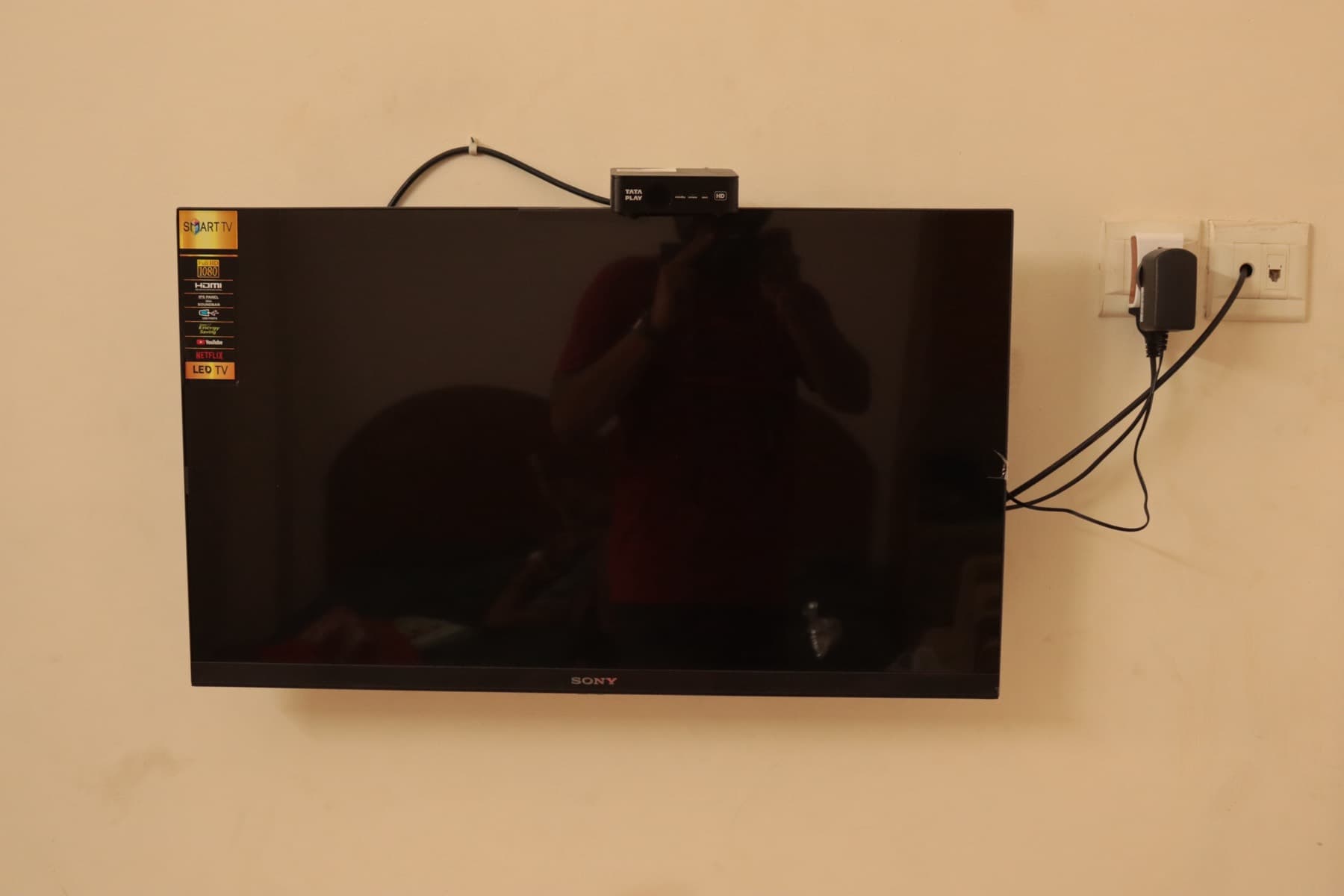 Wall-mounted flat-screen TV in the room